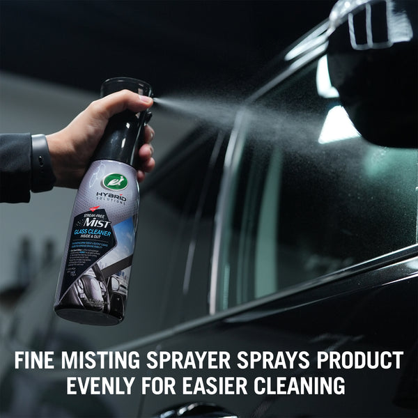Turtle Wax Hybrid Solutions Mist glass cleaner shown on a car window, streak free cleaning for inside and outside car windows.