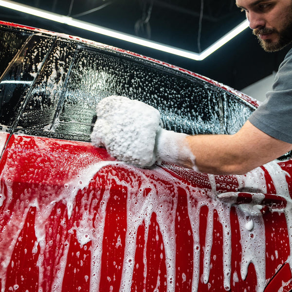 Turtle Wax car wash. Auto detailing with foam. Red car cleaned.