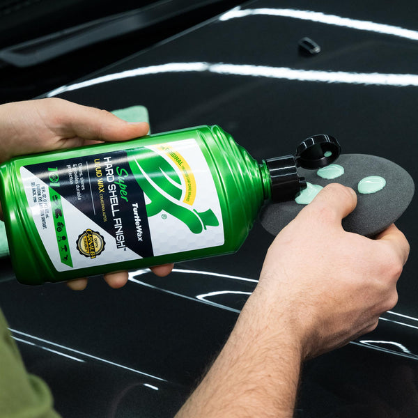 Turtle Wax Super Hard Shell Liquid wax being applied with a pad. Car detailing for a super shine finish, ideal for Indian cars.