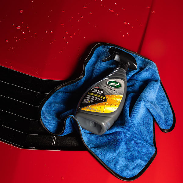 Turtle Wax Hybrid Ceramic Wet Wax on a red car with water droplets and blue cloth. कार चमकाने के लिए |