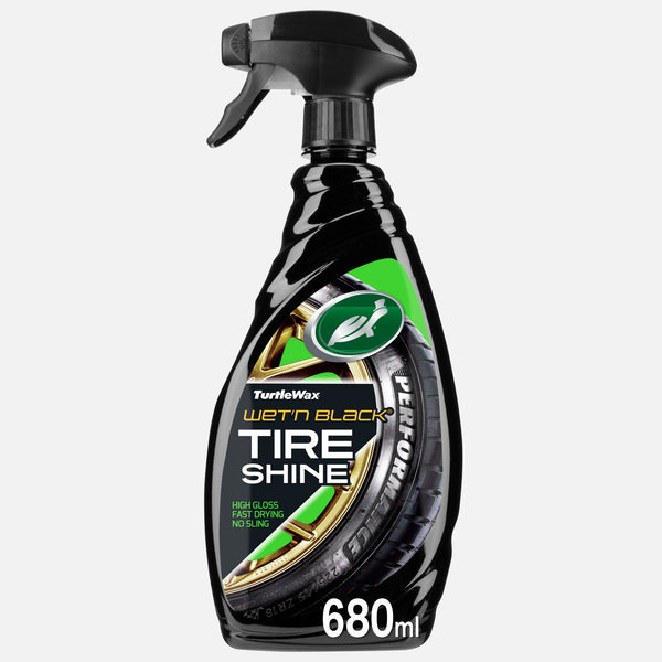 Turtle Wax Wet'n Black bottle with spray nozzle. Shining tires and the running turtle logo visible. Car care product.
