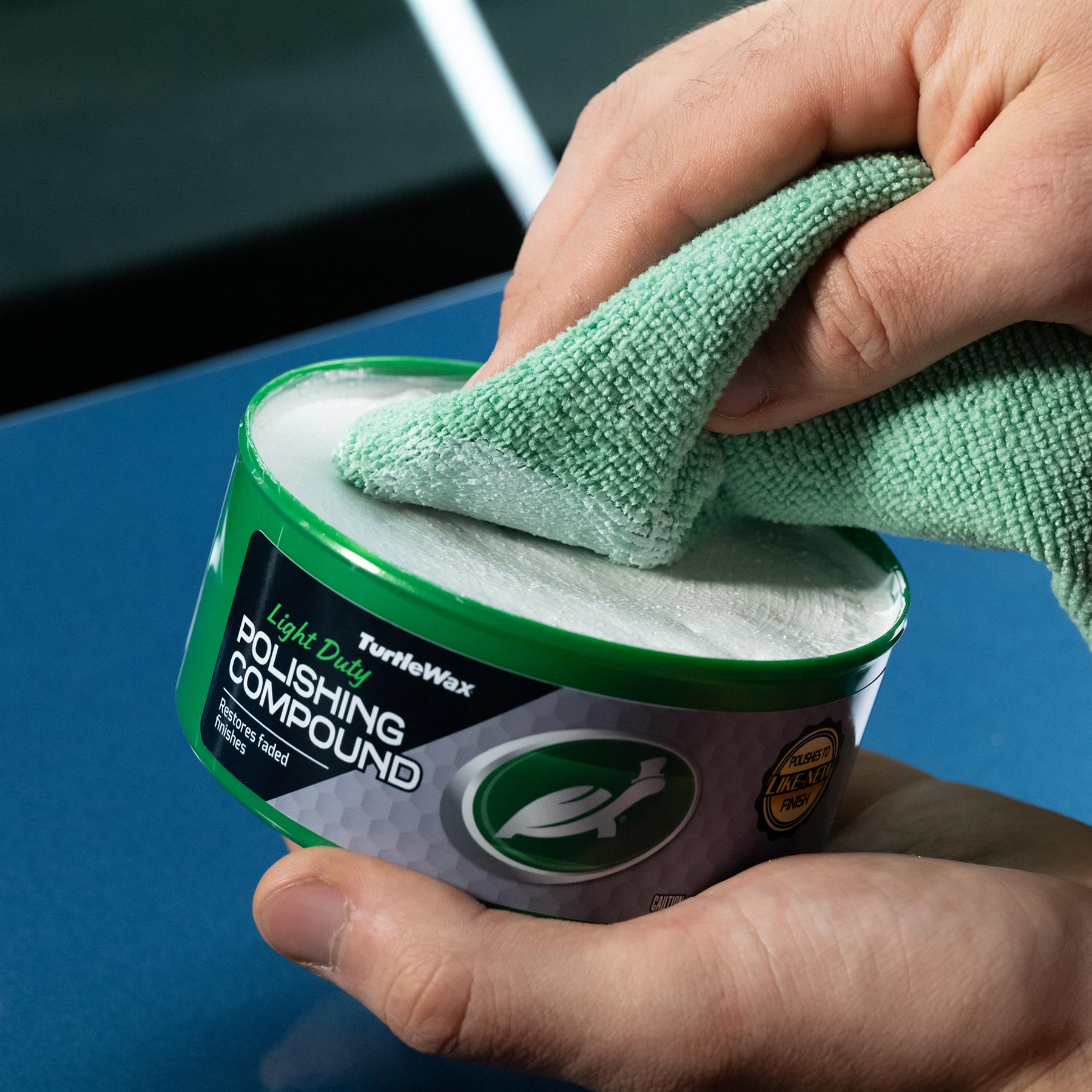 Turtle Wax light duty polishing compound to restore faded finish on cars in India. Using microfiber cloth for application.