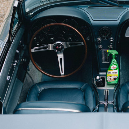 Turtle Wax Luxe Leather Cleaner on a classic car's blue leather interior. The wooden steering wheel is visible. #कार #लेदर
