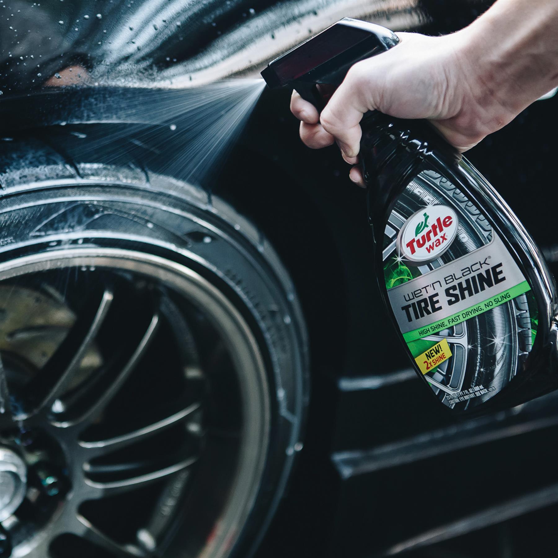 Turtle Wax Tire Shine spray being applied to vehicle tyre. Easy application for a glossy finish, auto detailing.