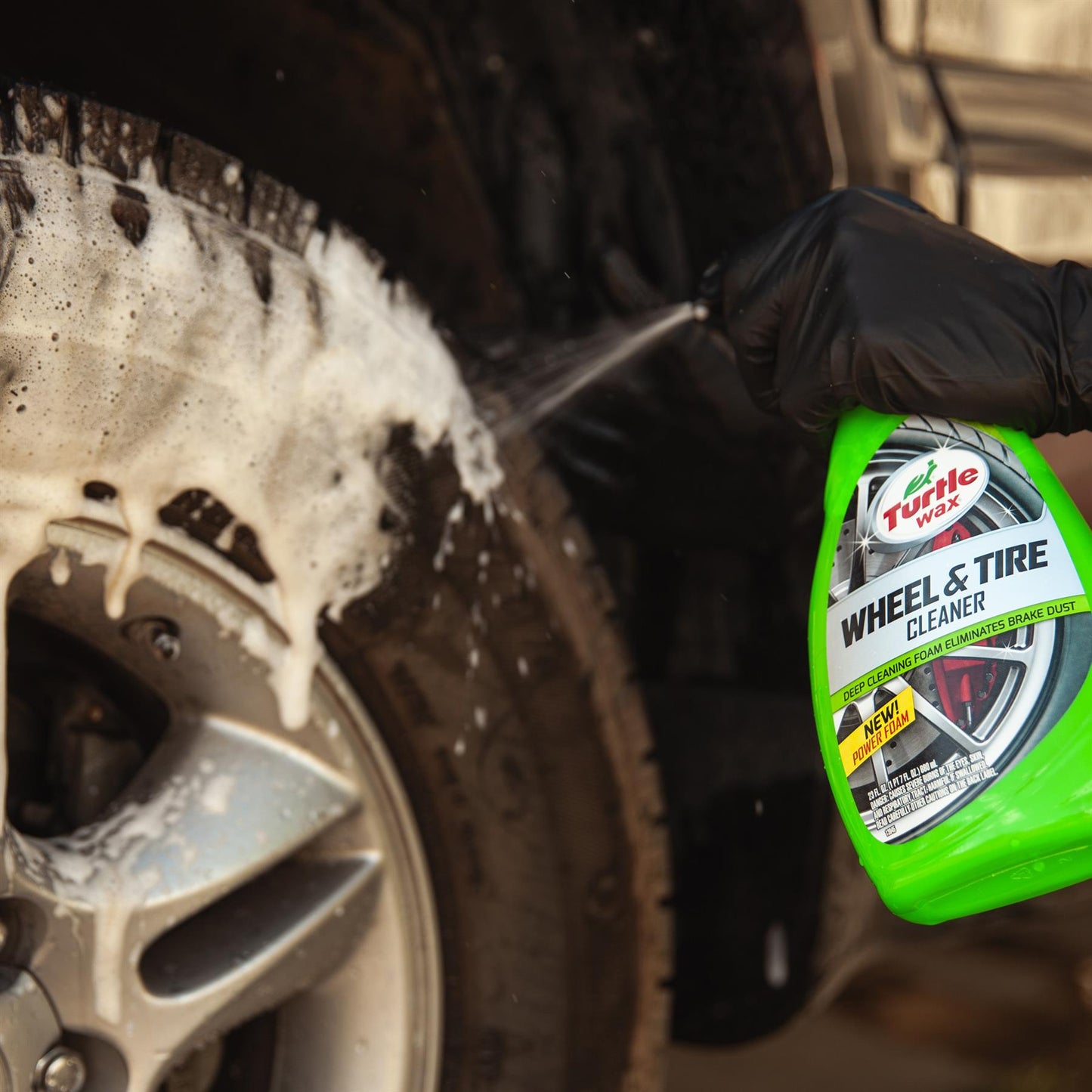 Turtle Wax wheel cleaner 680ml being sprayed on a dirty car tyre. Detailing for cars in India.
