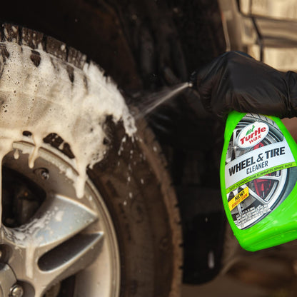 Turtle Wax wheel cleaner 680ml being sprayed on a dirty car tyre. Detailing for cars in India.