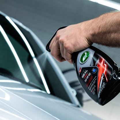 Car detailing in India: Hand sprays Turtle Wax ICE Seal N Shine for water repellent car care, giving a shiny finish.