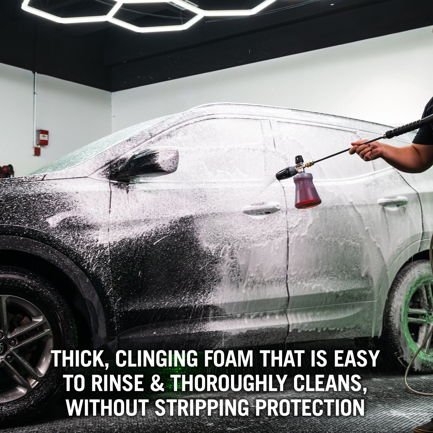 Car detailing in India: Foam cannon spray cleans car. Thick foam. No Turtle Wax seen.

