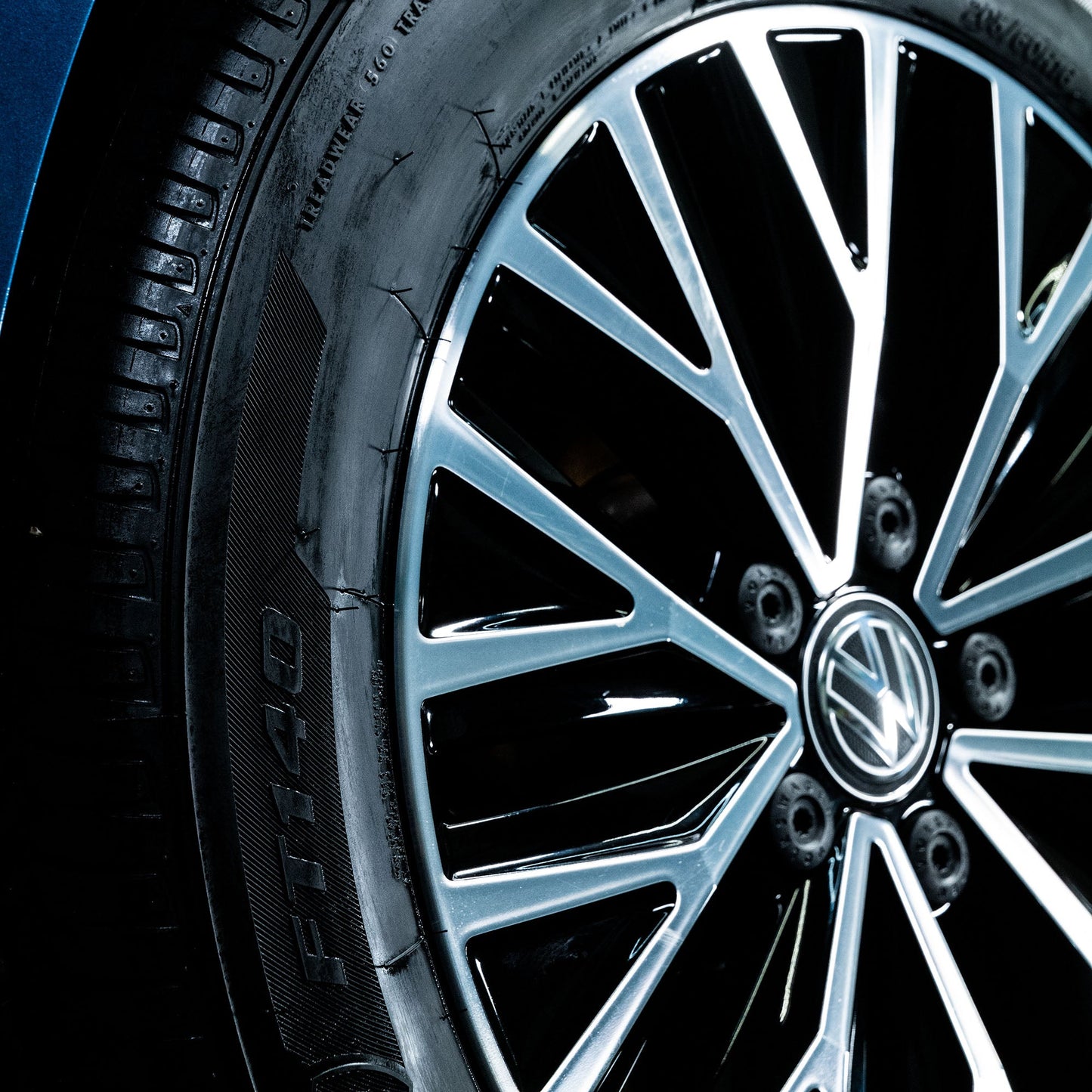 Close-up of a car tyre with a detailed rim, revealing a striking wheel design in India.