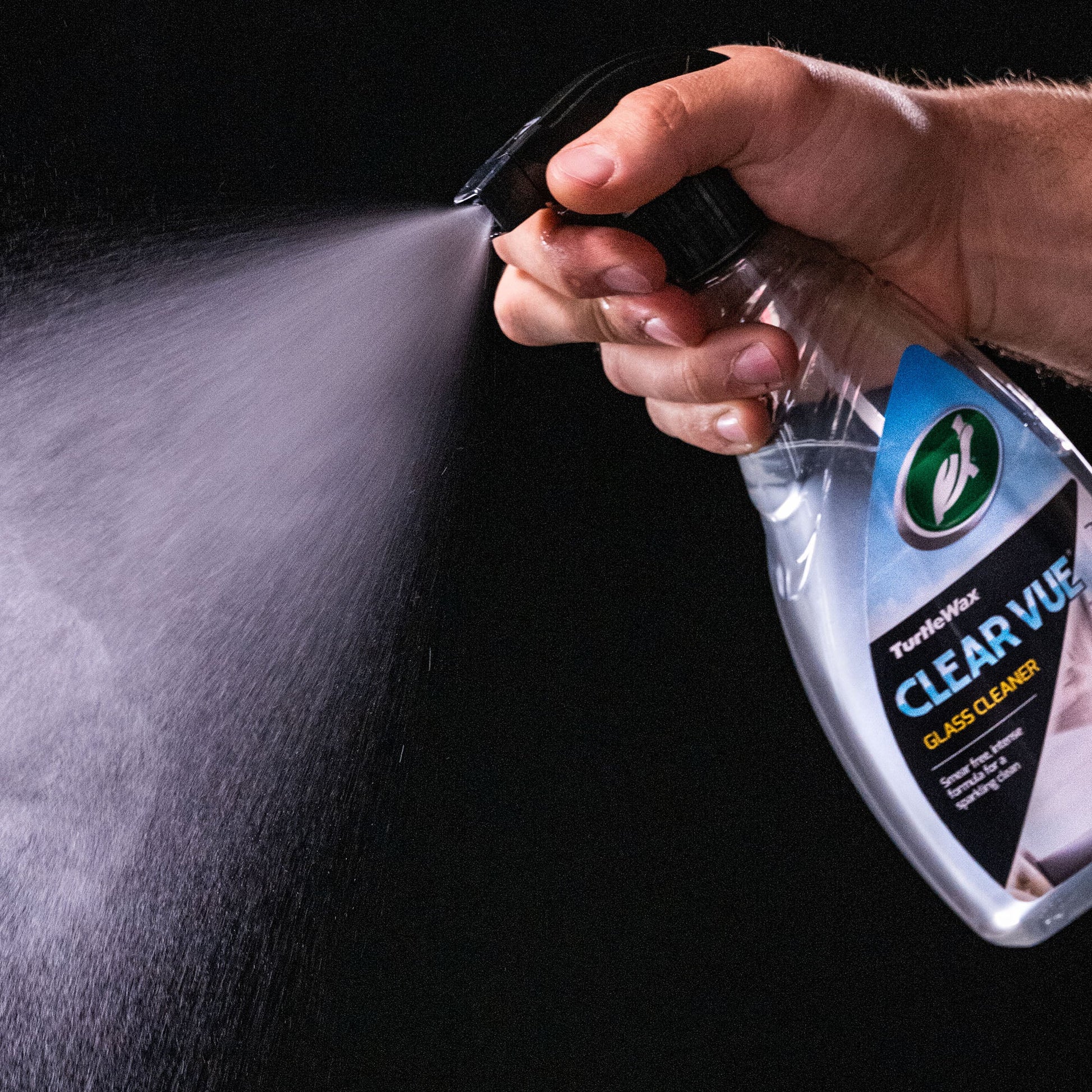 Turtle Wax Clear Vue Glass Cleaner Spray, spraying in the air. Great for a sparkling clean finish.