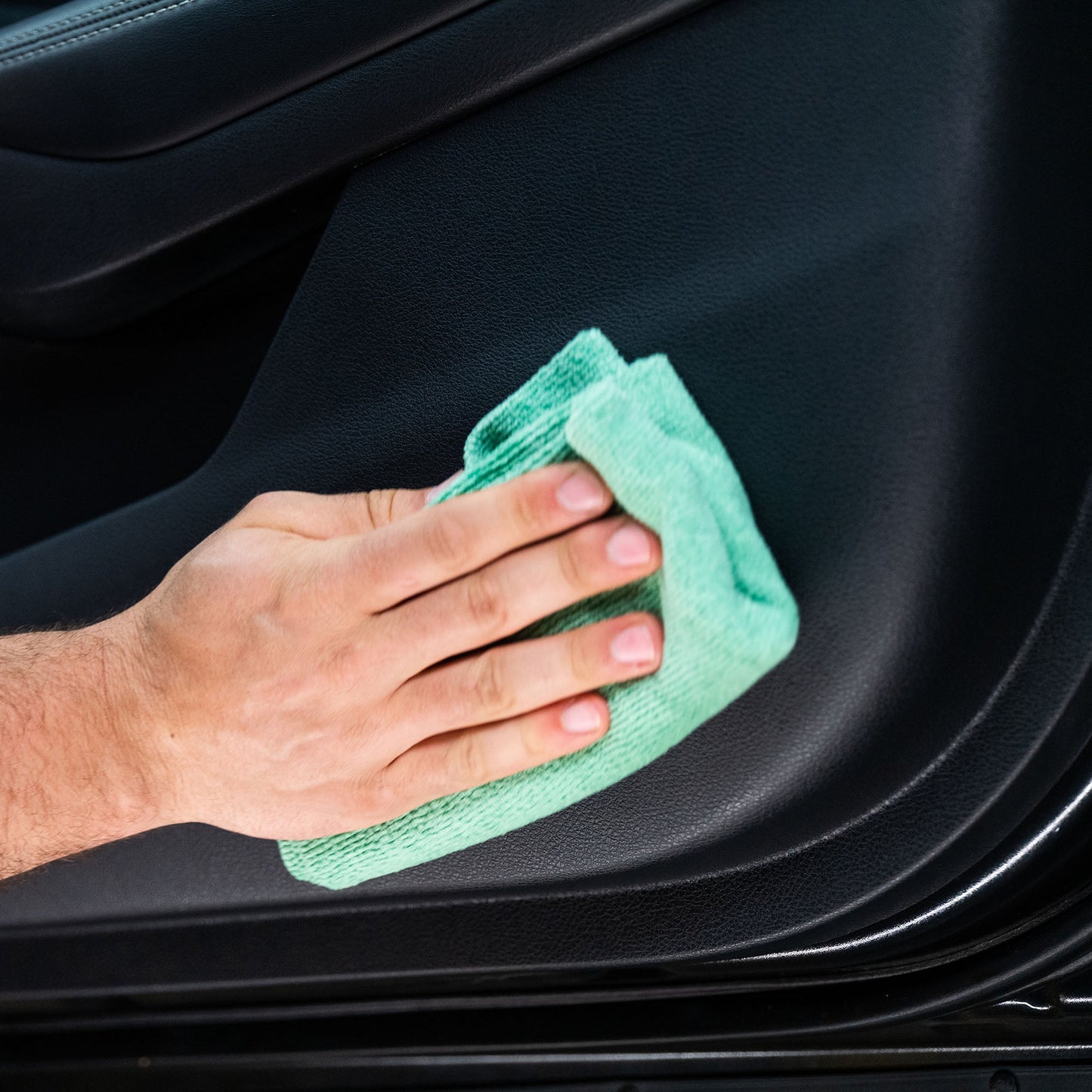 Car interior cleaning. Green cloth wiping dashboard. #carcleaning #detailing #automobile.
