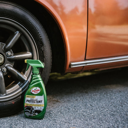 Turtle Wax Inside & Out Protectant near a car's Yokohama tyre and orange body. Quick, Easy shine and protection. #carcare #TurtleWaxIndia