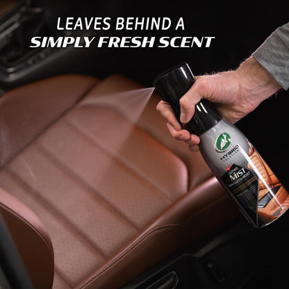 Turtle Wax Leather Mist being sprayed on a car's brown leather seat. Car care product for leather conditioning & cleaning in Bharat.