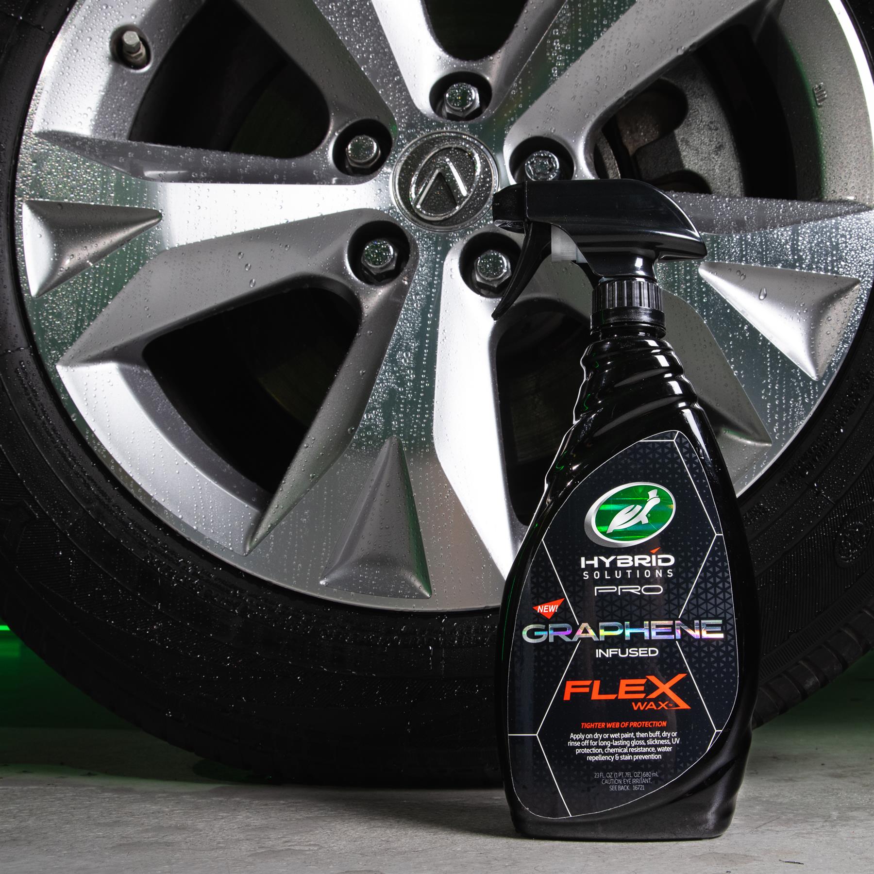 Turtle Wax Hybrid Solutions Pro Graphene Flex Wax, a car care product, is pictured with a clean, shiny alloy wheel.
