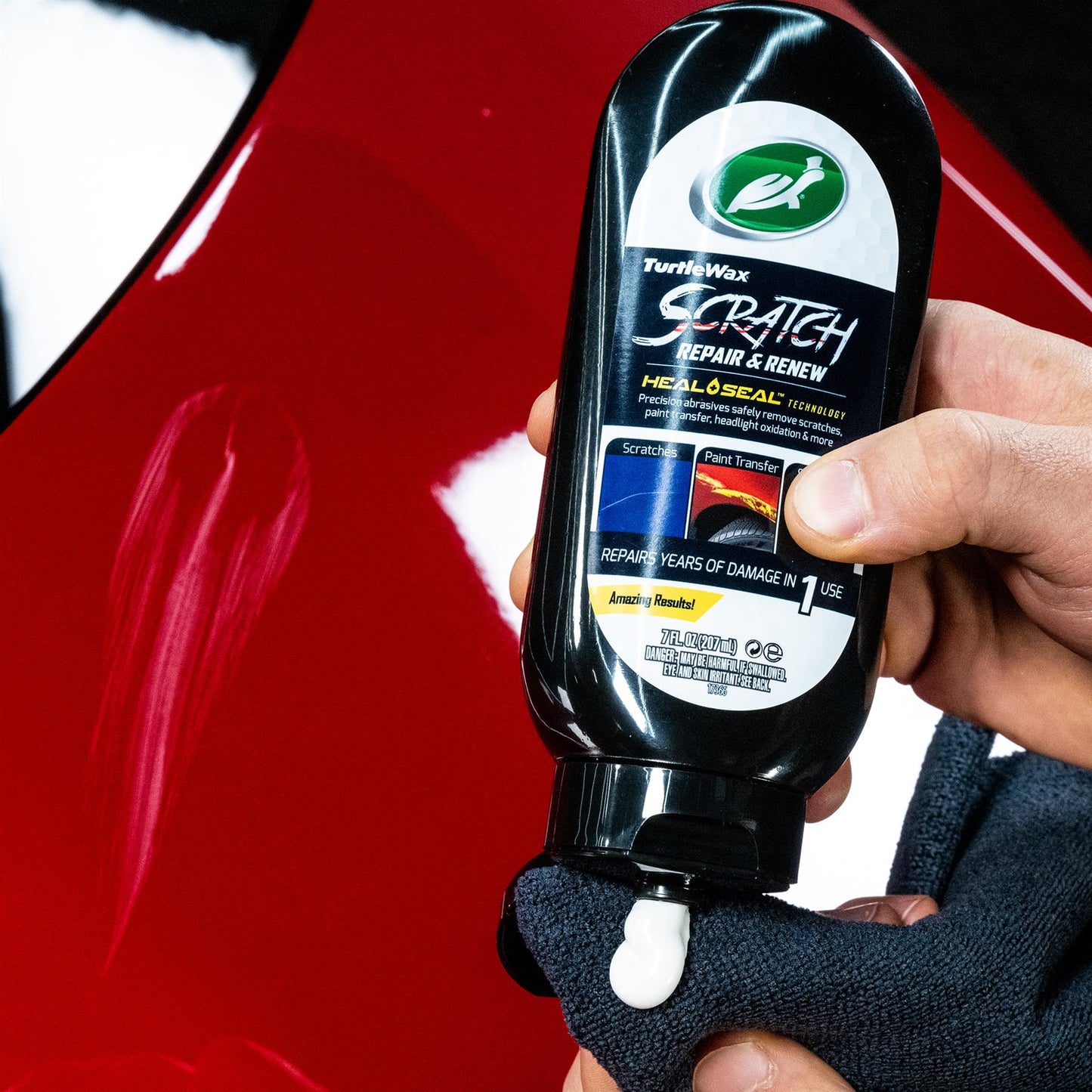 Turtle Wax Scratch Repair & Renew shown. 207ml bottle for car scratch removal on a red car. Auto detailing in India.