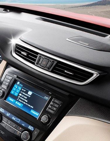 Car dashboard detail showcases AC vents, a console display, and sleek interior components, ideal for vehicle aesthetics in India.
